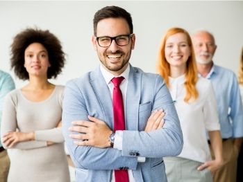 Group of different aged people standing and smiling