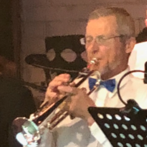 Howard S playing trumpet in a band
